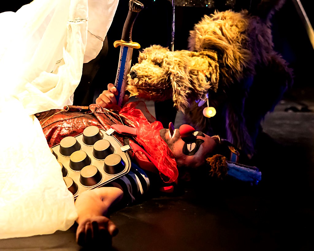 Wingus the hand-built dog puppet performing on stage
